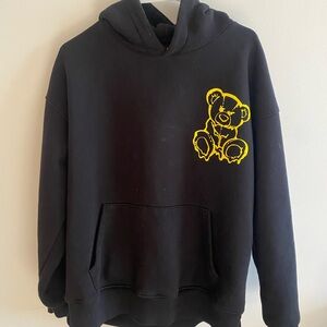 Black Hoodie with Yellow Bear Graphic